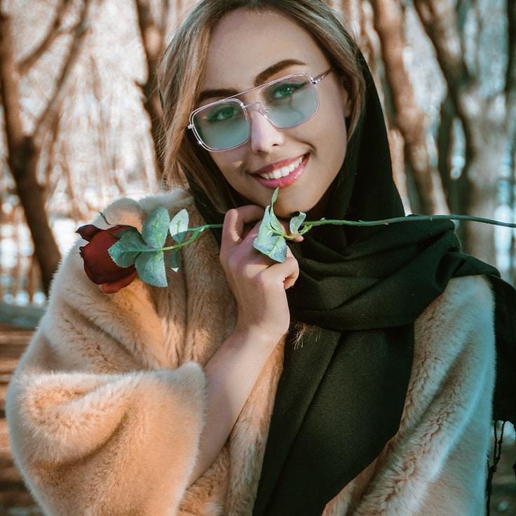 Kaveri Mehta, Lead Design Curator at HarvestWarmCollect, reviewing corporate floral arrangements